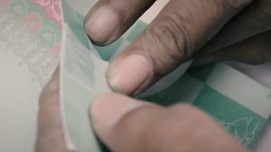 Repairing a torn graphic novel page using archival tape